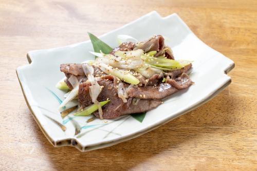 Stir-fried beef tongue with green onions and salt