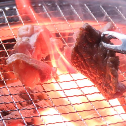 Grilled meat of charcoal fire in the sauna