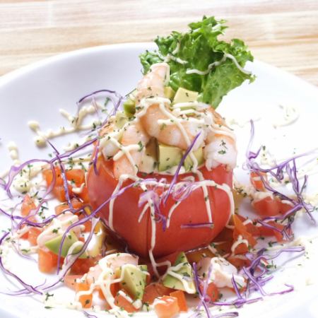 Stylish whole tomato salad stuffed with shrimp and avocado