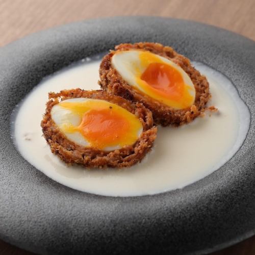 Scotch eggs with truffle white sauce