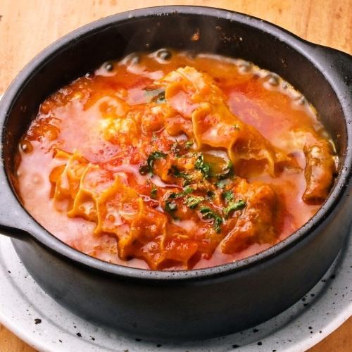 Beef tendon and tripe stewed in tomato sauce