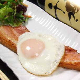 Thick cut bacon and half-boiled fried egg