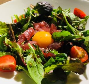 Tuna and salmon yukhoe-style salad with sesame and Parmesan cheese