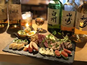 Our proud assortment of 12 kinds of smoked meats (photo shows a portion for 2 people)