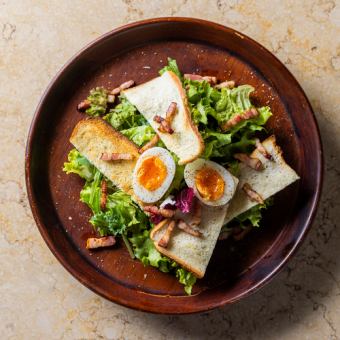 Caesar salad with bacon and soft-boiled eggs