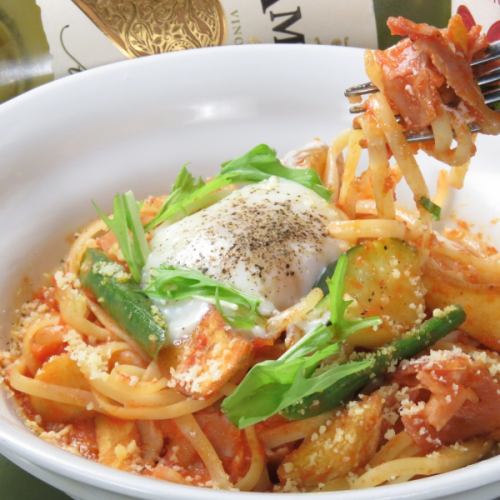 Tomato pasta with soft-boiled egg, bacon and seasonal vegetables