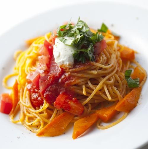 Tomato pasta with basil and cheese