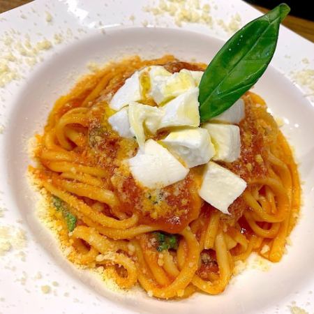 Tomato sauce pasta with mozzarella and basil