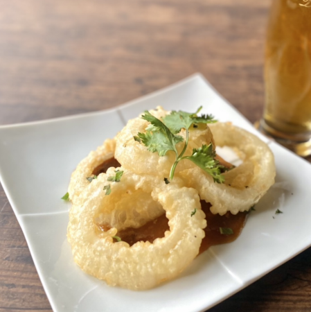 New onion fritters with spicy sauce