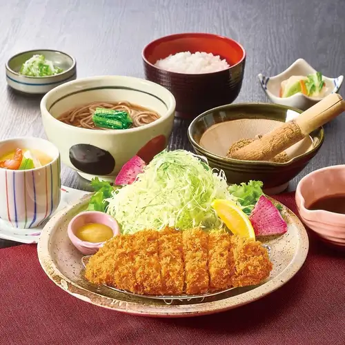 Pork cutlet set meal with a complimentary steamed egg custard.