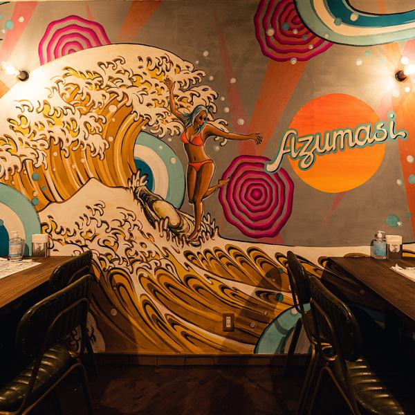 The table seating area with its colorful mural covering an entire wall is perfect for girls' nights out, guys' nights out, precious family time, and of course, dates! The popular mural depicts oysters and beer, Mount Yotei, and the tufted puffin that inhabits Hokkaido!