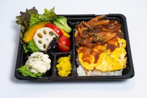 A lunch box of fluffy demi-glace omurice and healthy vegetables