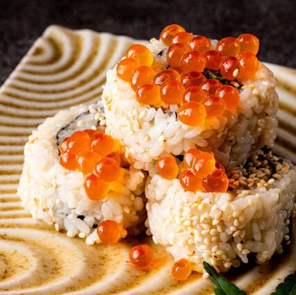 Salmon wrapped in perilla leaf with salmon roe.