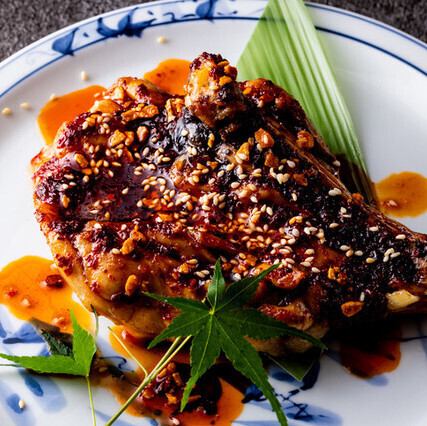 Grilled chicken thigh with bone