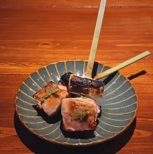 Tiger chicken thigh skewers with skin on, served with yuzu pepper.