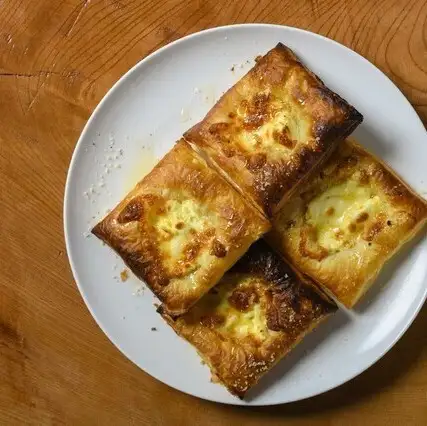 Three-cheese tarte flambée