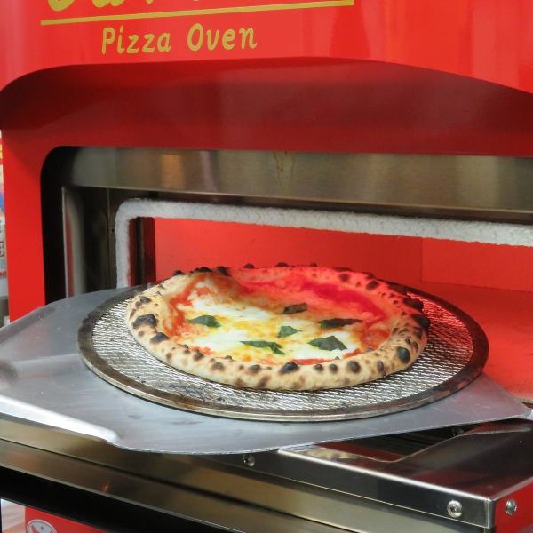 [Margherita] baked in a state-of-the-art pizza oven