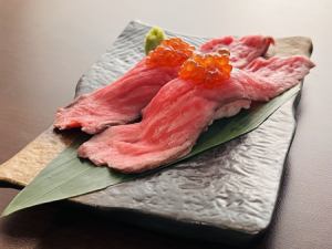 Wagyu beef sushi (2 pieces) topped with salmon roe