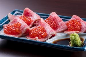 Wagyu beef sashimi topped with salmon roe