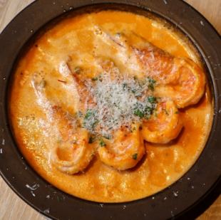 Grilled large shrimp with simmering tomato cream