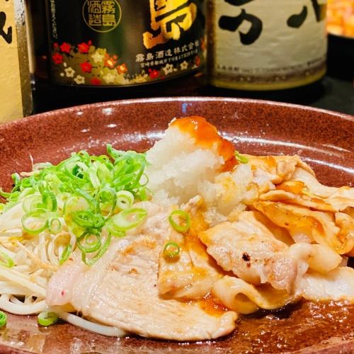 Thinly sliced Kirishima pork loin grilled on an iron plate Japanese-style grated daikon radish
