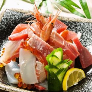 Bowl of rice topped with sashimi