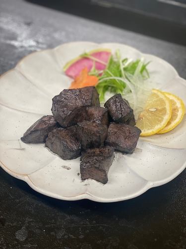 Black grilled beef heart