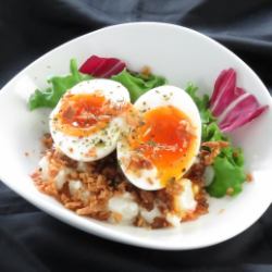 Potato salad with soft-boiled egg and minced meat