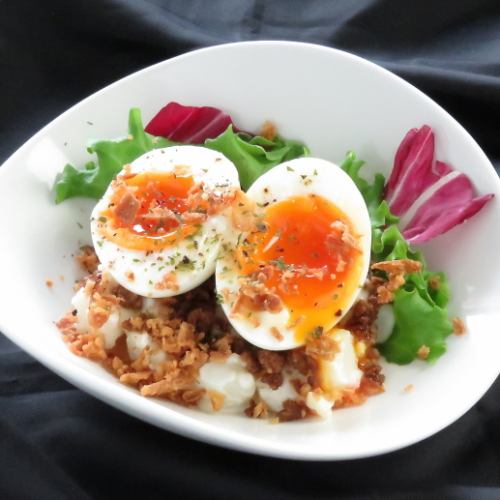 Potato salad with soft-boiled egg and minced meat