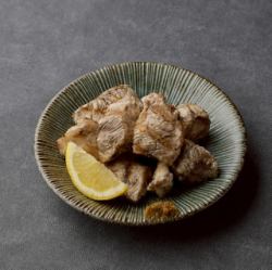 Grilled chicken breast over charcoal
