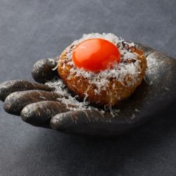 Grilled rice ball with egg yolk and Pecorino cheese
