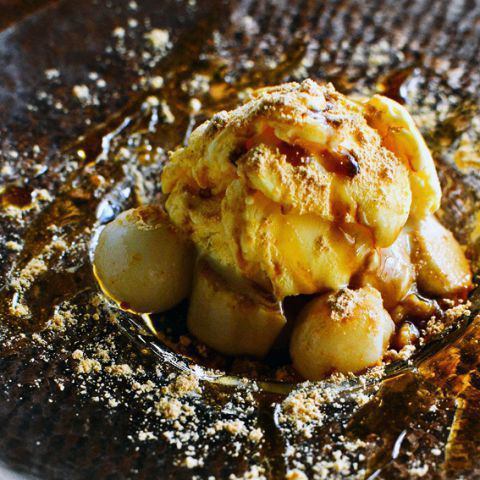 Sesame pudding and vanilla ice cream covered with brown sugar syrup