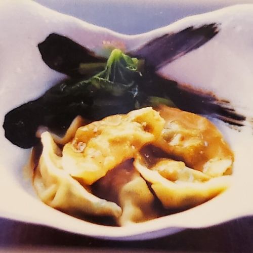 Boiled gyoza with spicy sesame sauce