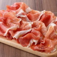 Freshly sliced prosciutto crudo