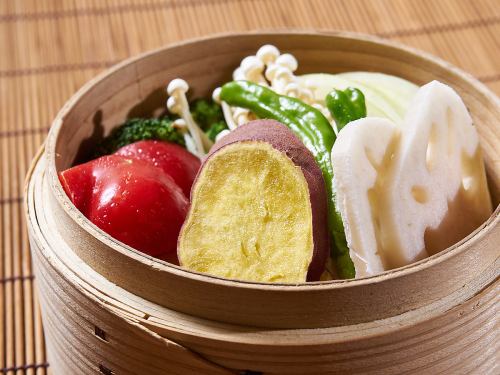 Selected vegetables steamed in a bamboo steamer