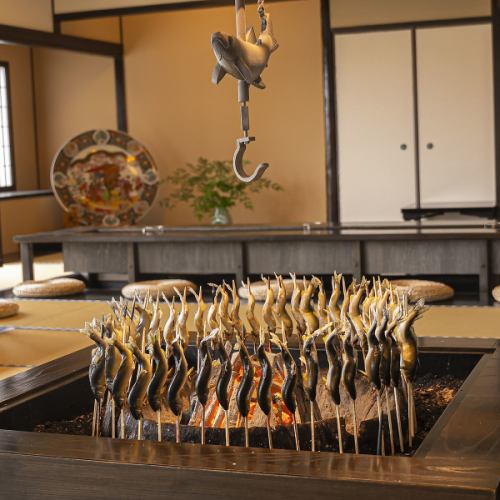 Wild-caught sweetfish from Lake Biwa are grilled on our large hearth.