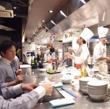 A kitchen full of energy from the chef and staff.
