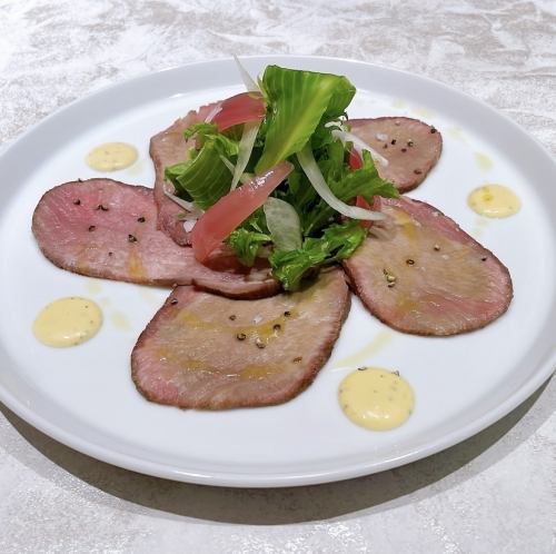 Moist and tender homemade smoked beef tongue with seasonal salad