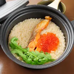 Salmon and salmon roe rice in an earthenware pot