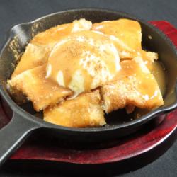 Fried focaccia topped with vanilla ice cream