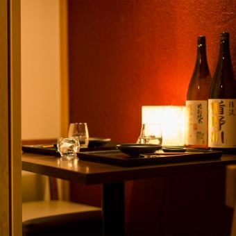 [Table seats for 2 to 4 people] Private rooms with soft lighting for small groups.