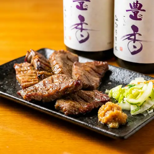 Thickly sliced grilled beef tongue