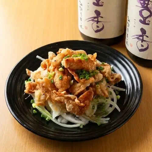 Crispy chicken skin with ponzu sauce