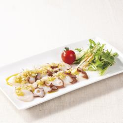 Raw octopus carpaccio with pepper oil sauce