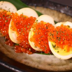 Salmon roe topped with seasoned egg