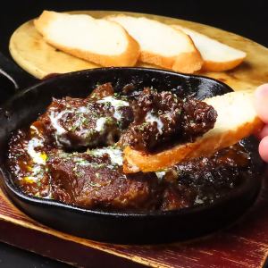 Delicious black beef stew with baguette