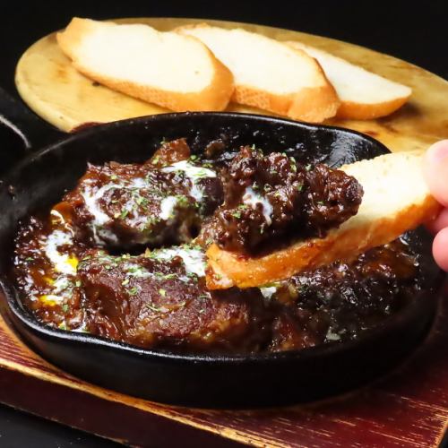 Delicious black beef stew with baguette