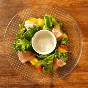 Prosciutto and tropical fruit salad