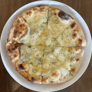 Four kinds of cheese pizza that pairs well with honey (in-store only)