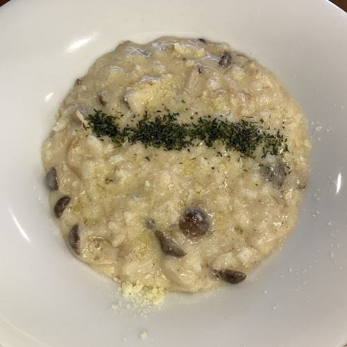 Creamy risotto with plenty of mushrooms and porcini sauce